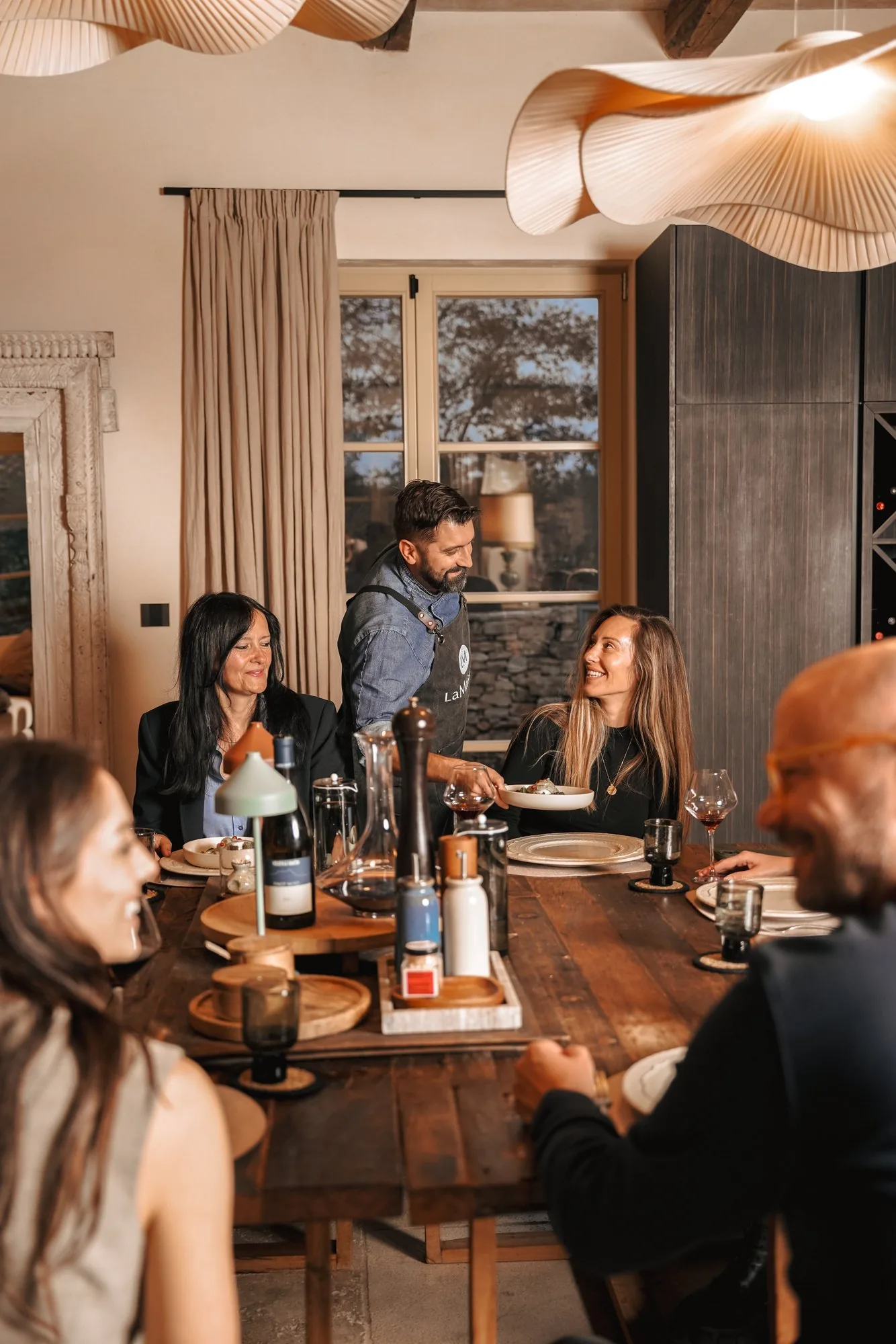 Guests at dinner with wine at LaMaison