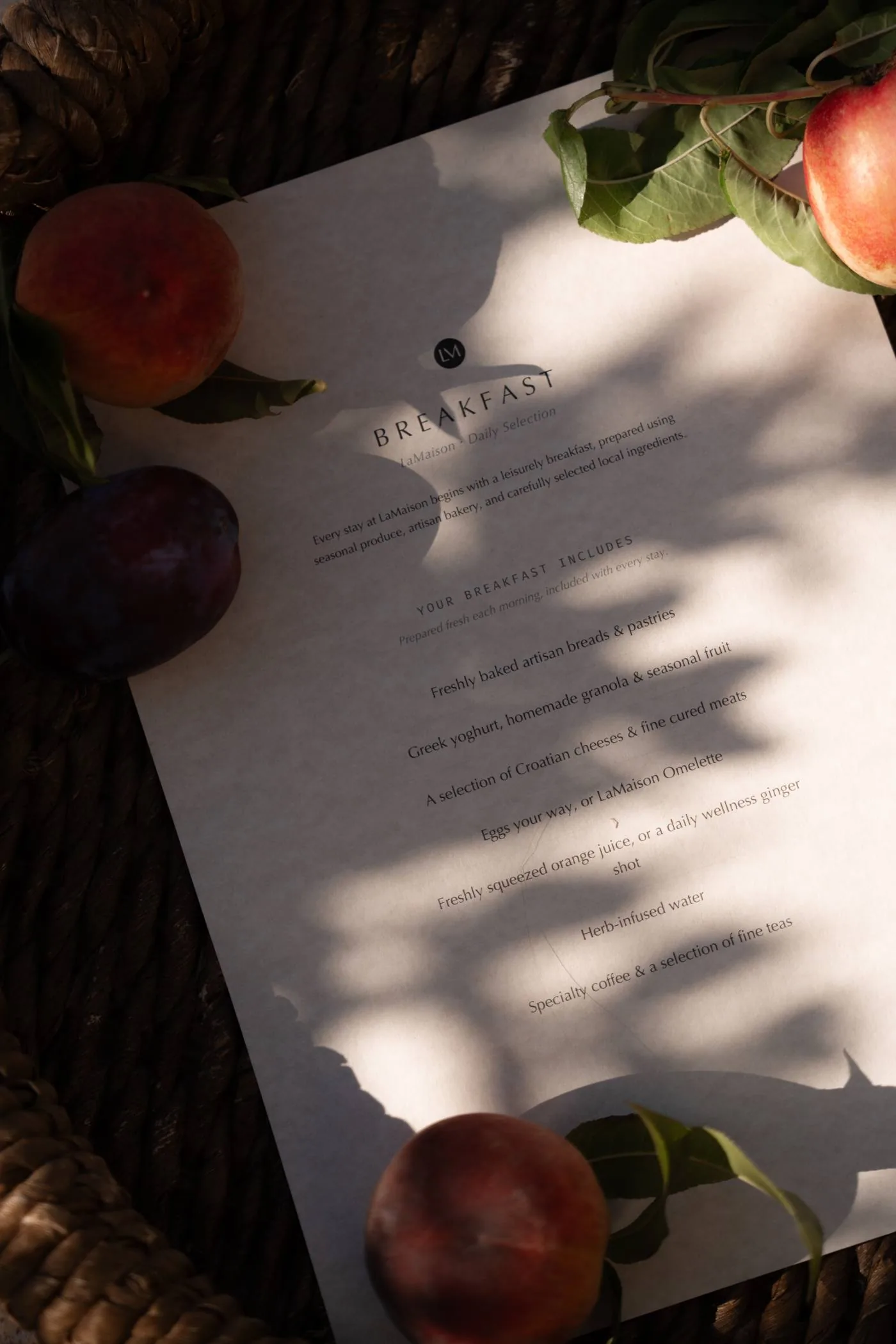 A breakfast menu on the table in the morning sun at LaMaison
