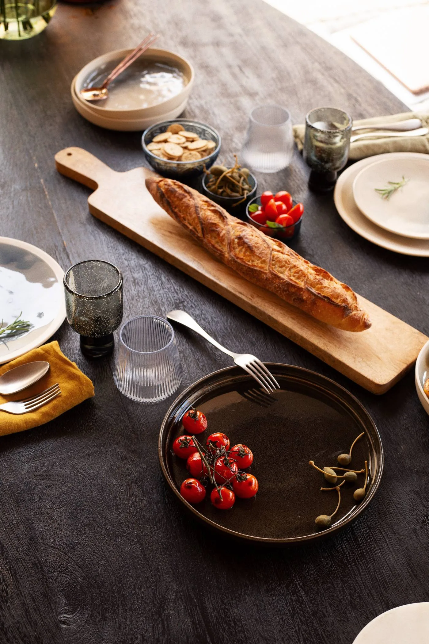 A table laid with bread and produce at LaMaison