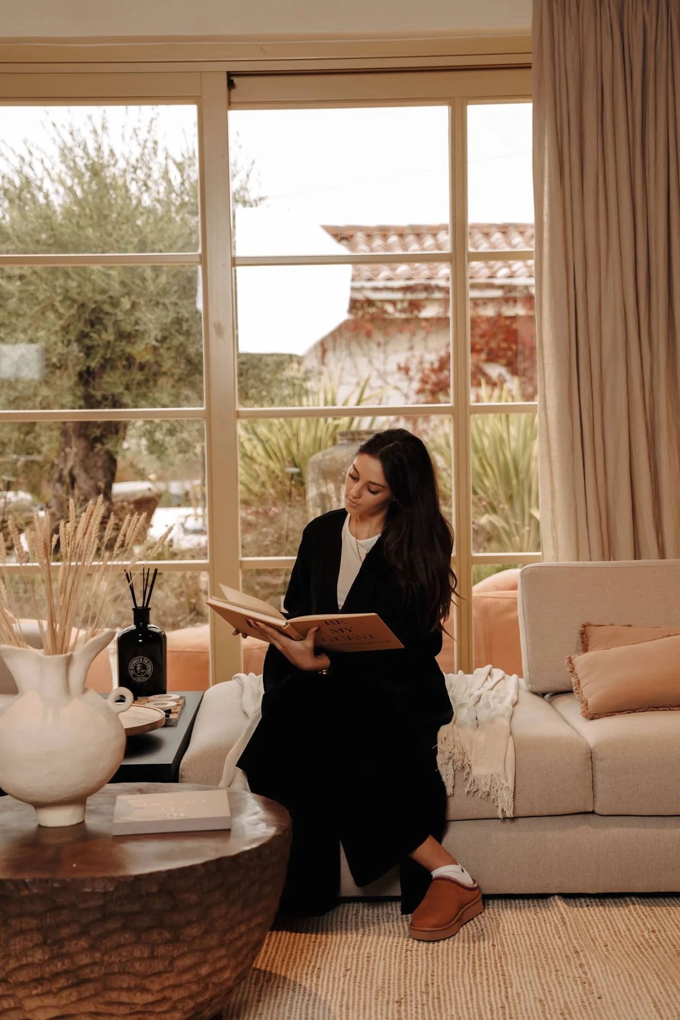 A quiet morning with a book by the window at LaMaison