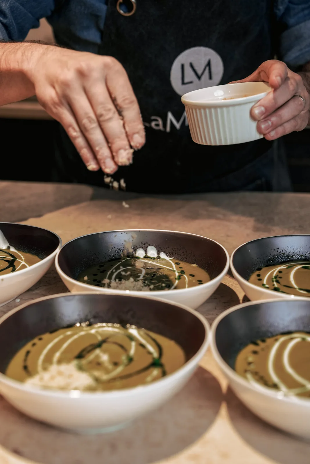 The chef adding a final touch at LaMaison