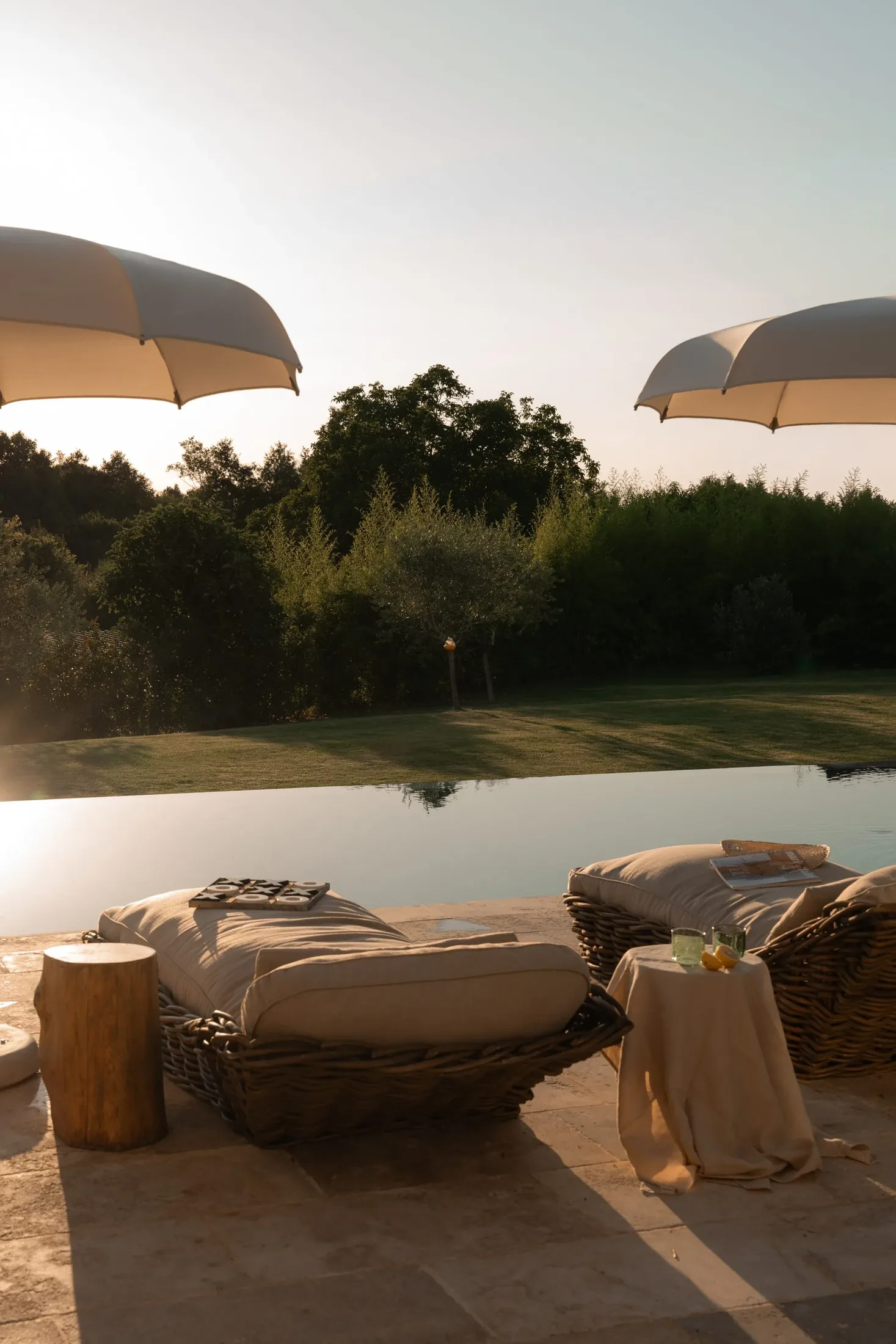 Loungers by the salty pool at LaMaison in the morning light